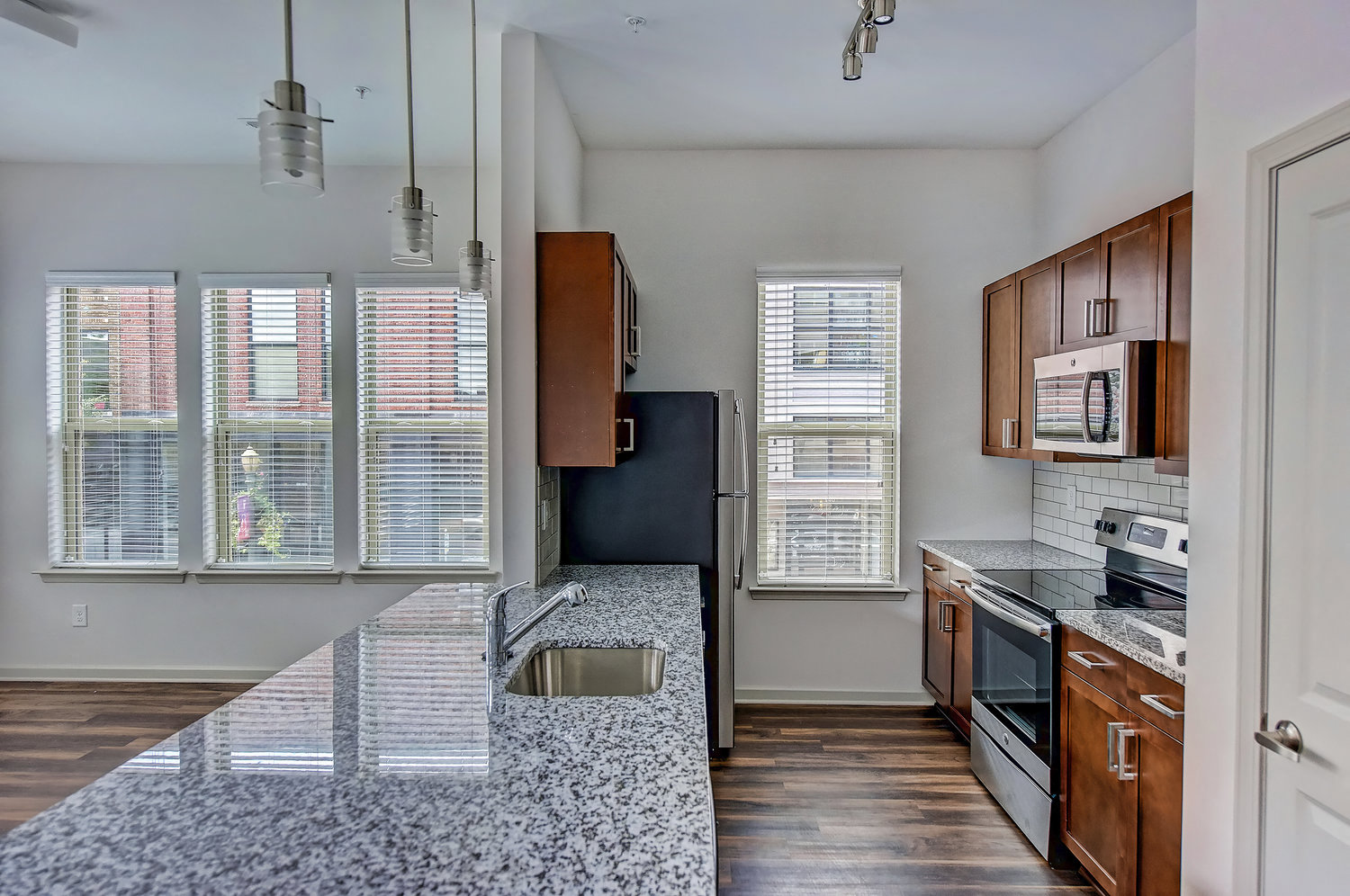 a kitchen with granite counter tops and a sink