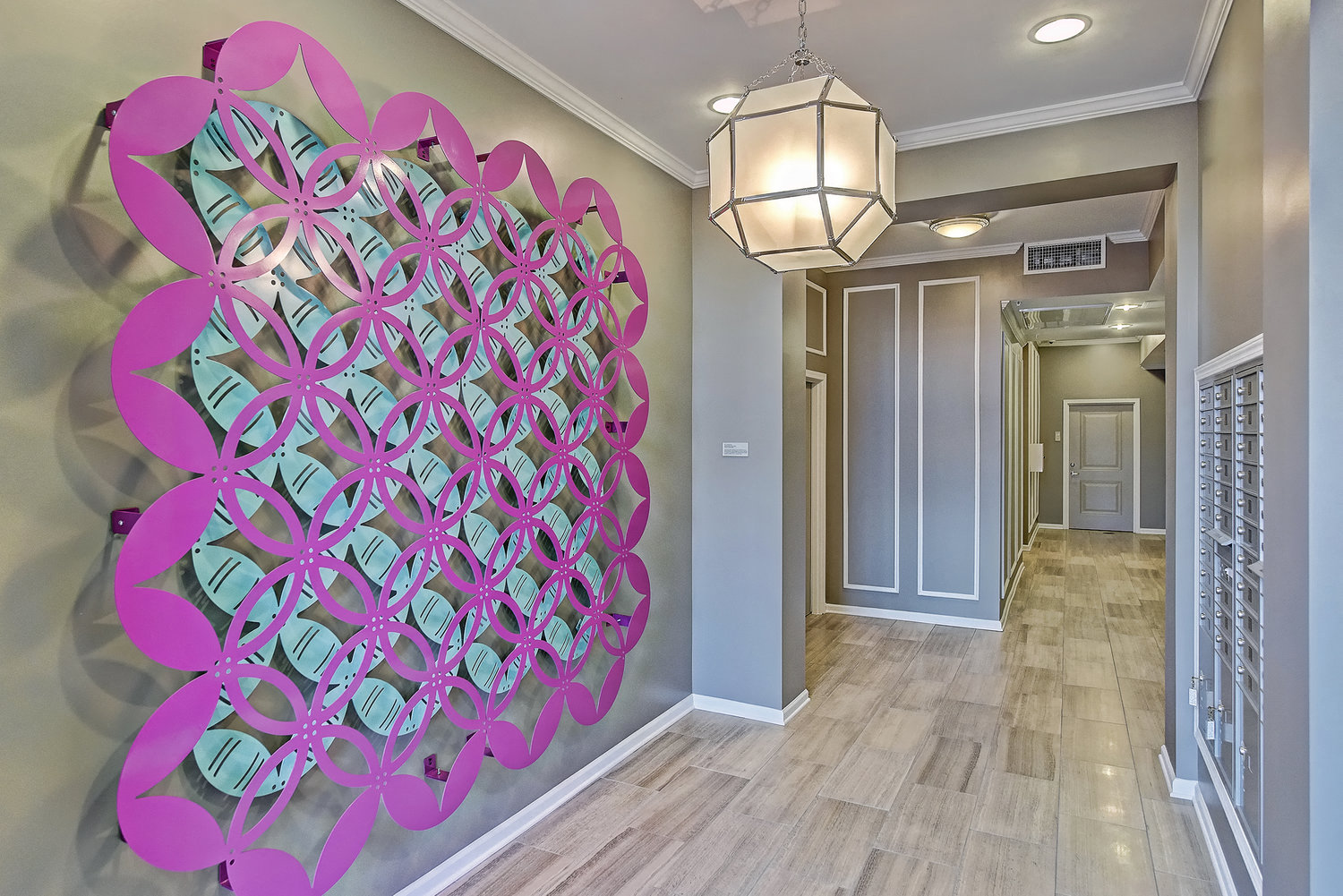 a hallway with a mural on the wall of a hallway