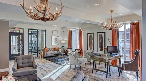 a living room with couches and chairs and a tv