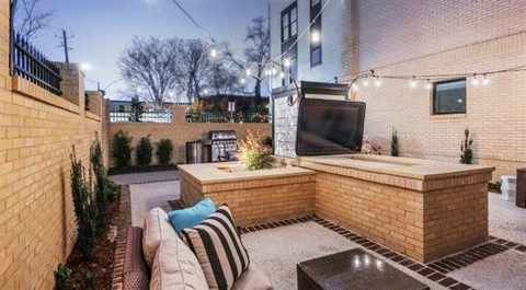 a living room with a tv and a patio
