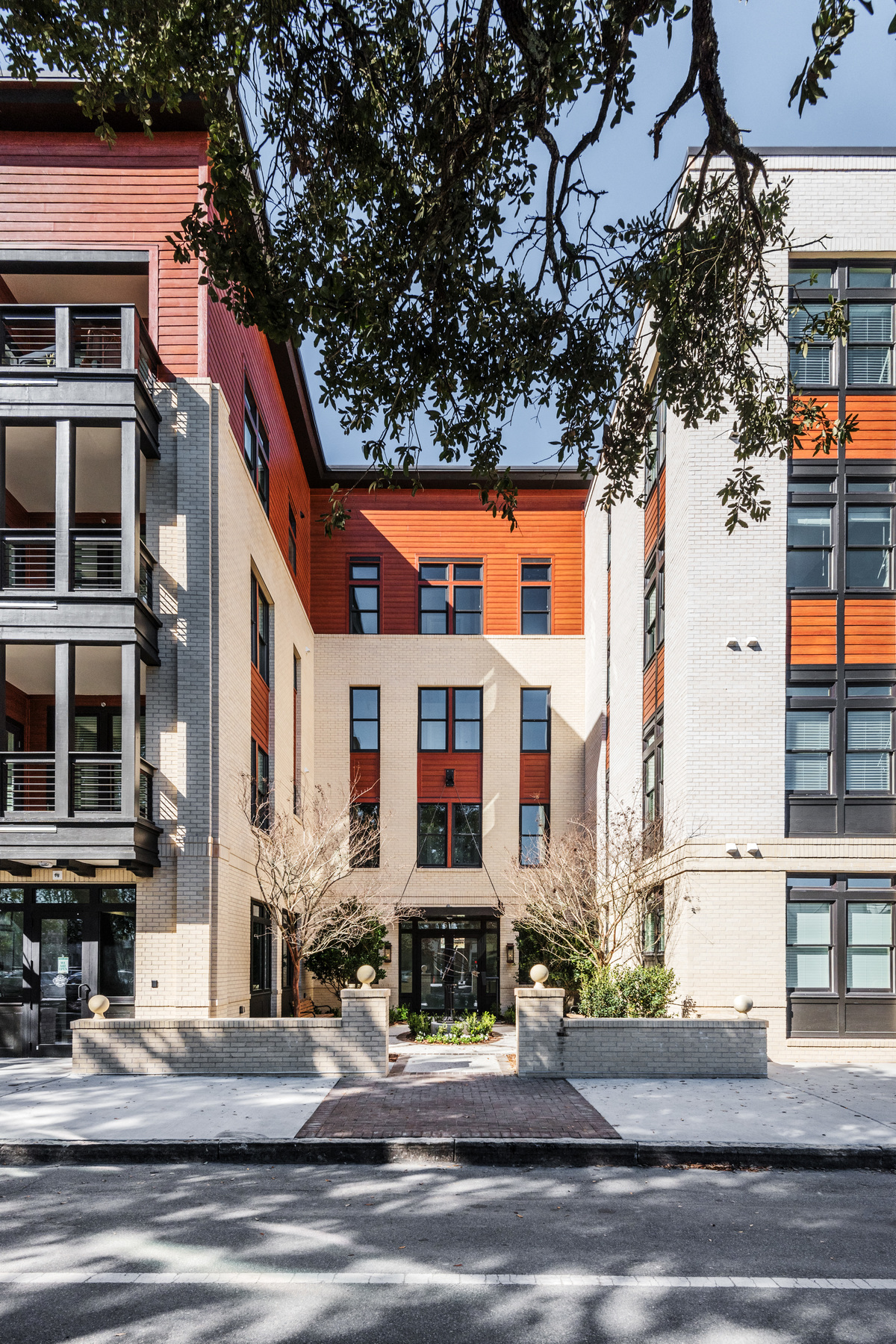the exterior of a condo building on a city street