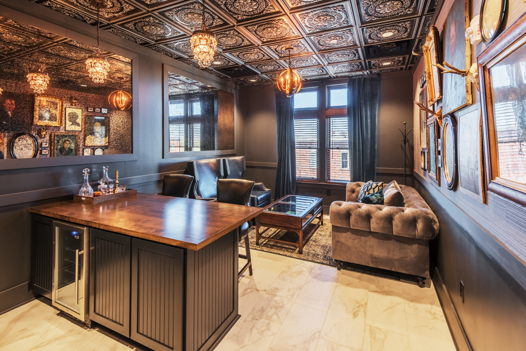 a conference room with a leather couch and a wooden desk