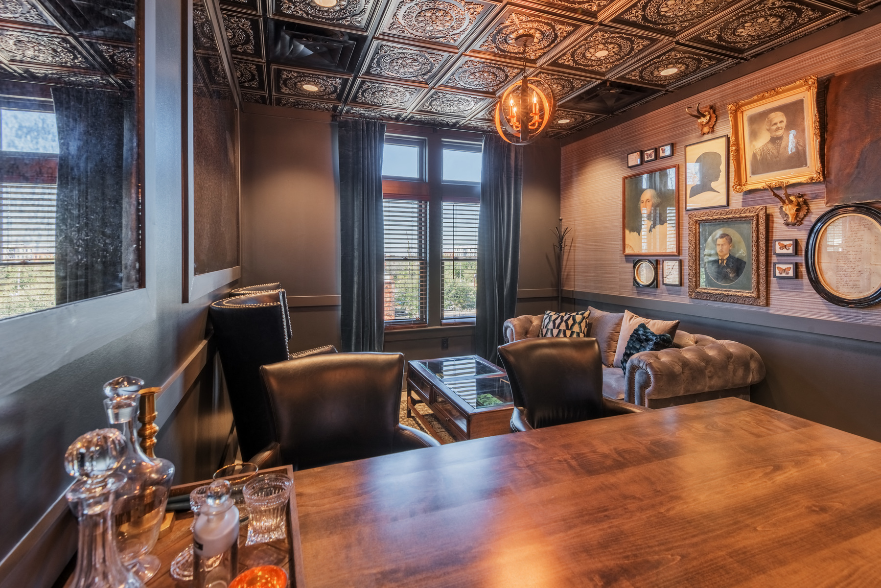 a conference room with a wooden table and leather furniture