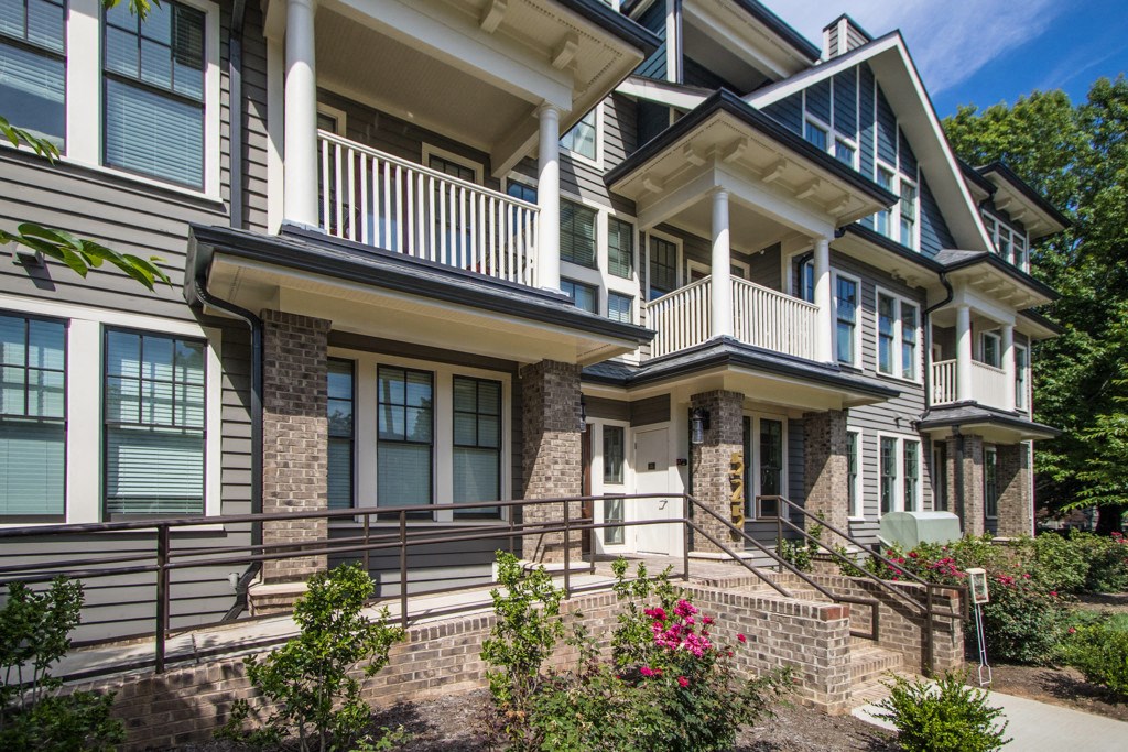a view of a house with a front porch and stairs