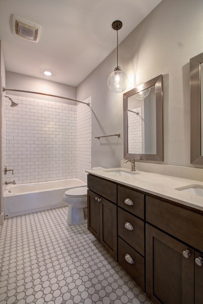 a bathroom with a sink and a toilet and a bath tub