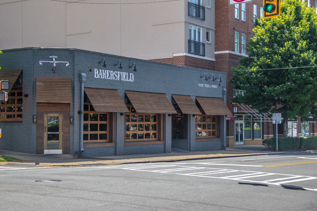 a restaurant on the corner of a city street