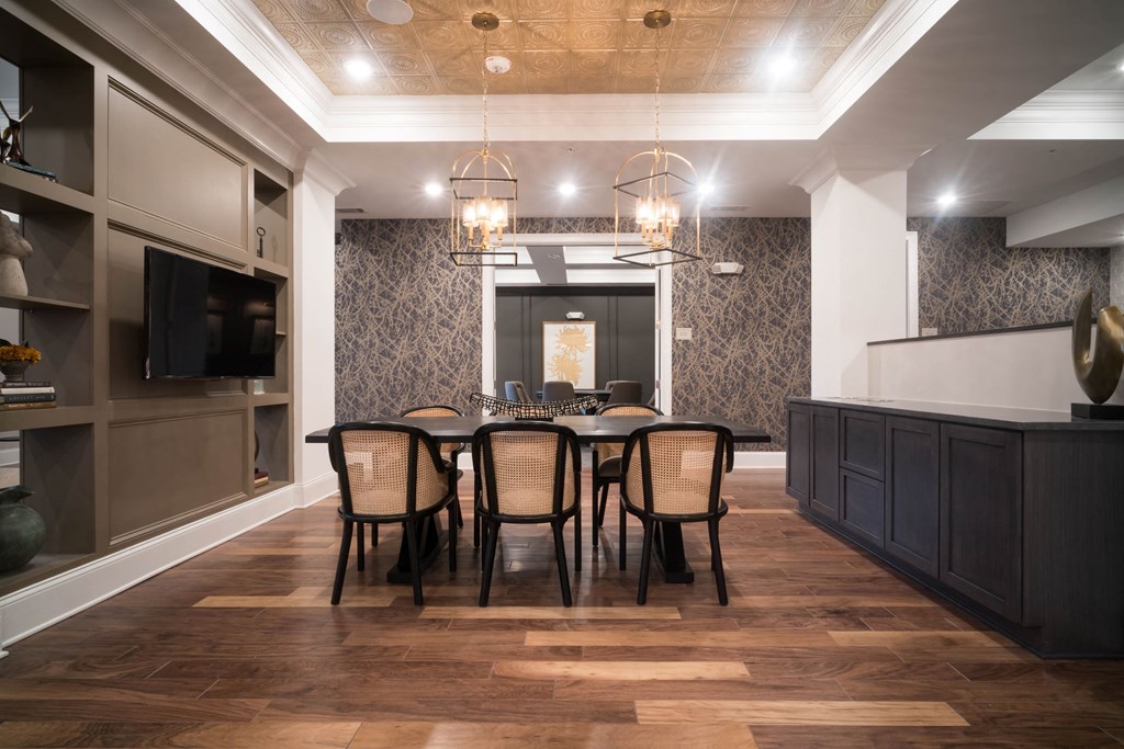 a dining room with a table and chairs