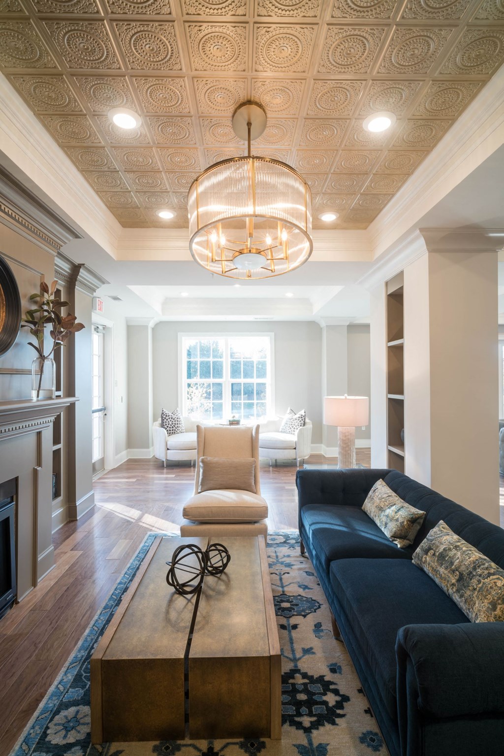 a living room with a blue couch and a coffee table