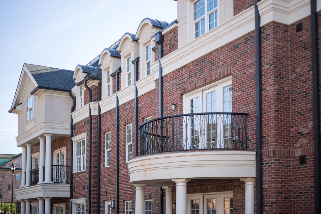 a large brick building with a balcony