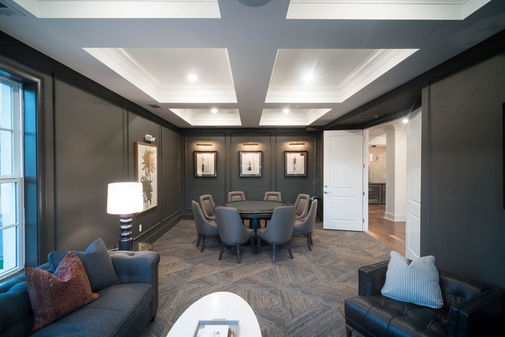 a conference room with a round table and couches