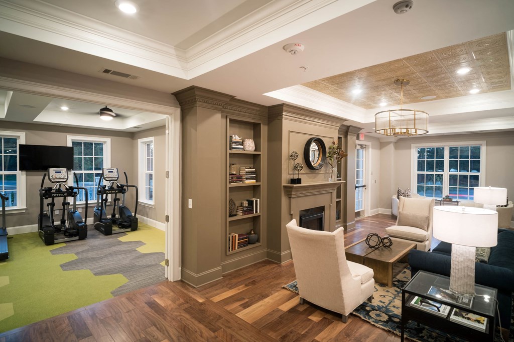 a living room filled with furniture and a fire place