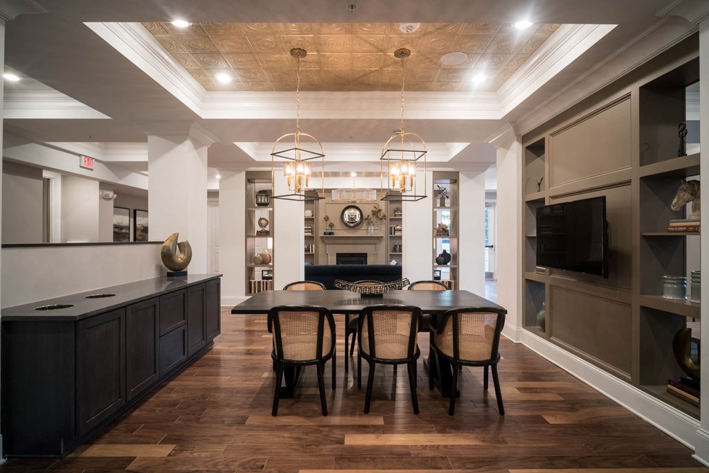 a dining room with a table and chairs and a fireplace