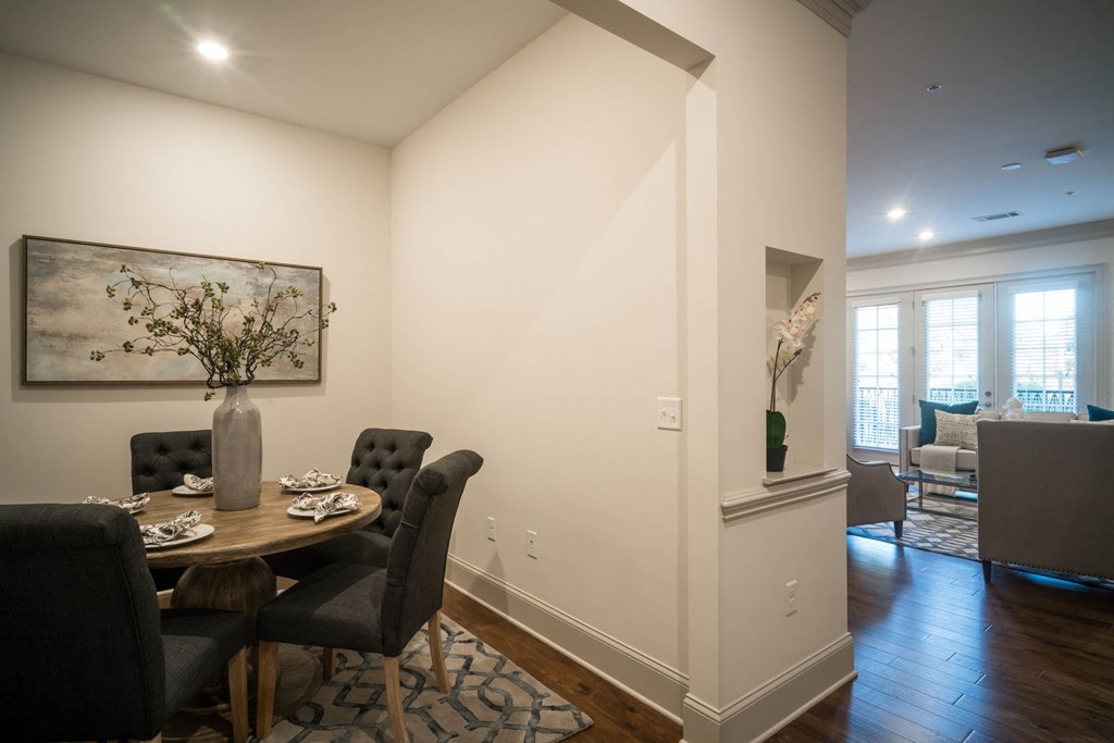 a dining room with a table and chairs