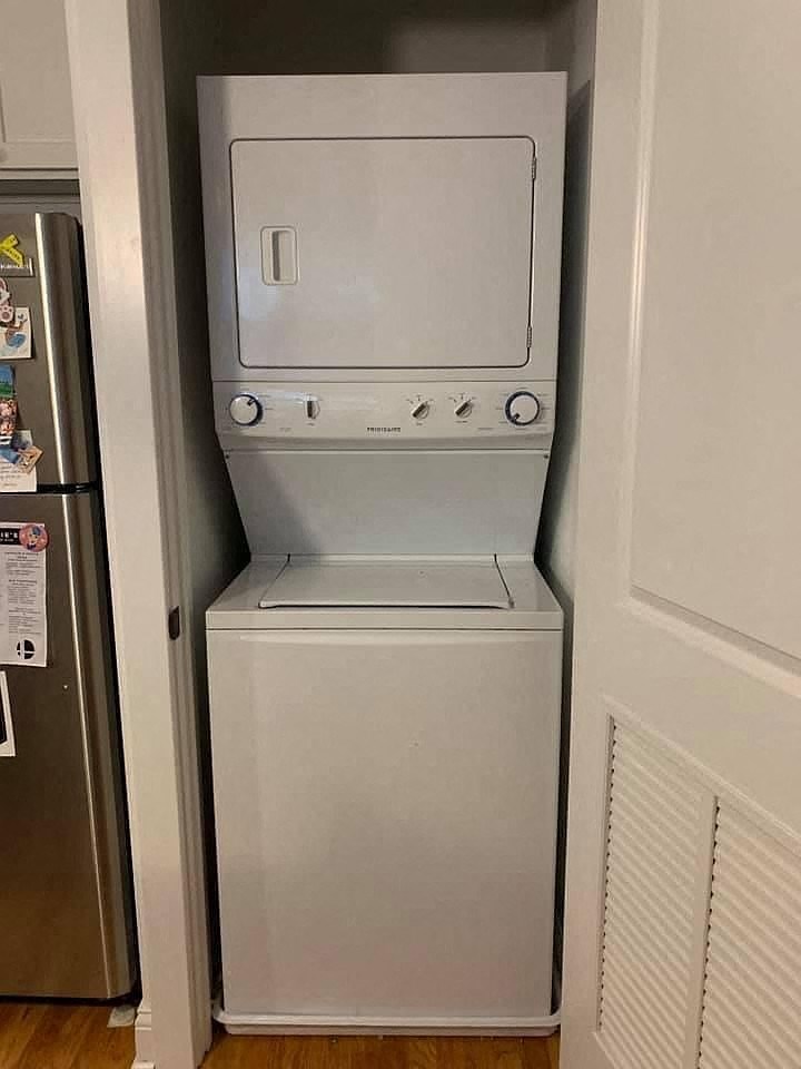 a white refrigerator and freezer in a door