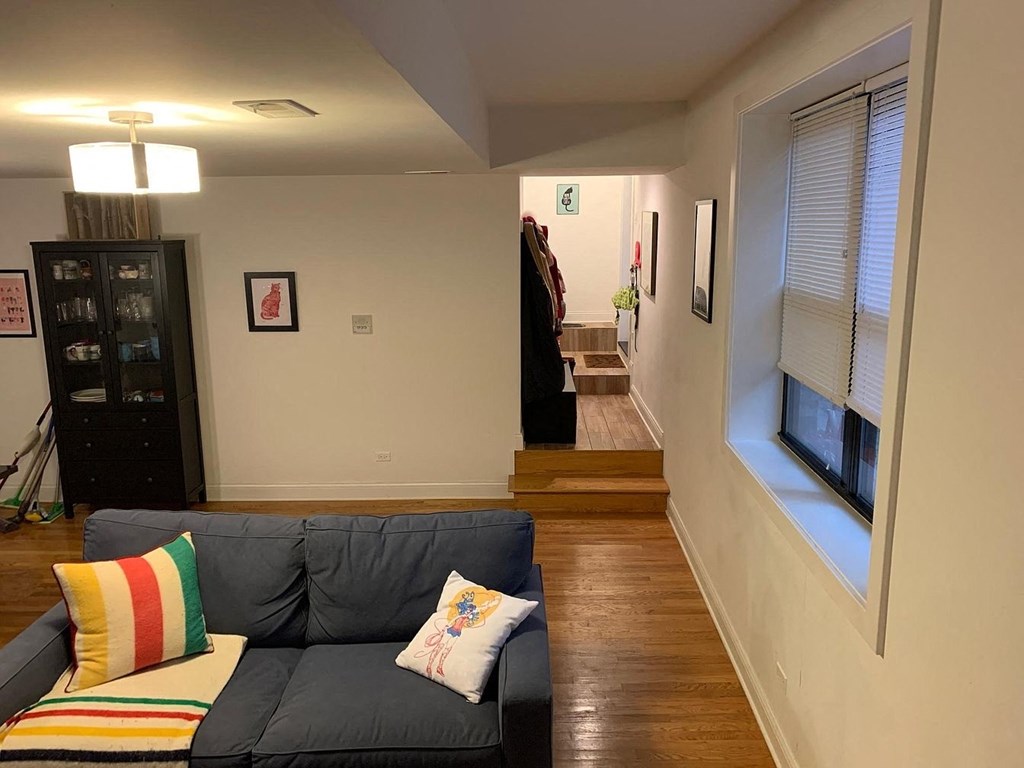 a living room with a couch and a window