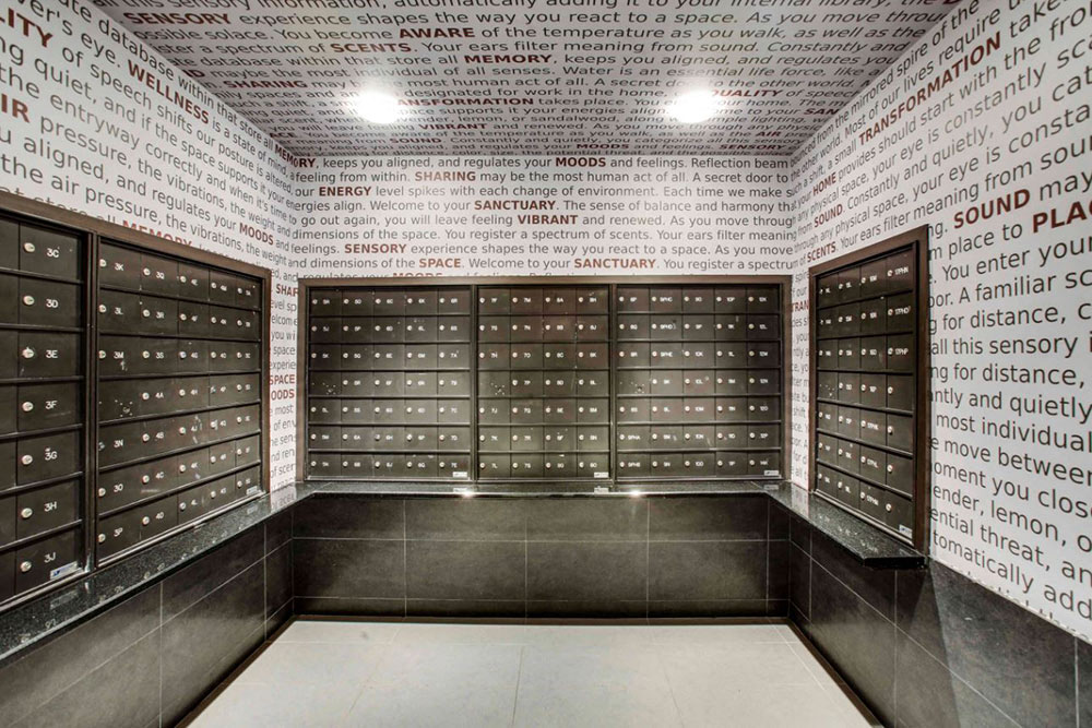 a bank of lockers with messages written on them in a room