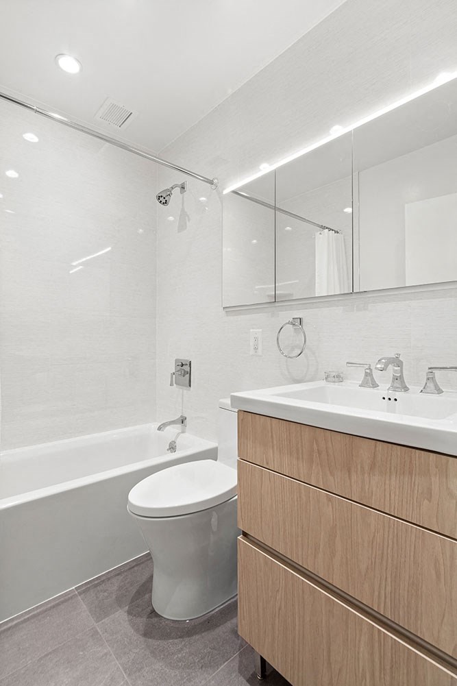 a bathroom with a toilet and a sink