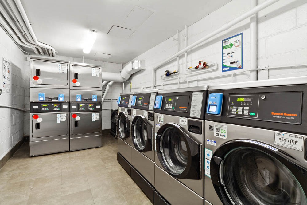 a laundromat with a row of washing machines