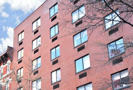a large red brick building with many windows