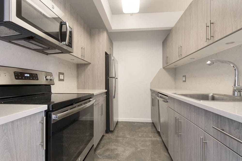 a kitchen with stainless steel appliances and a sink