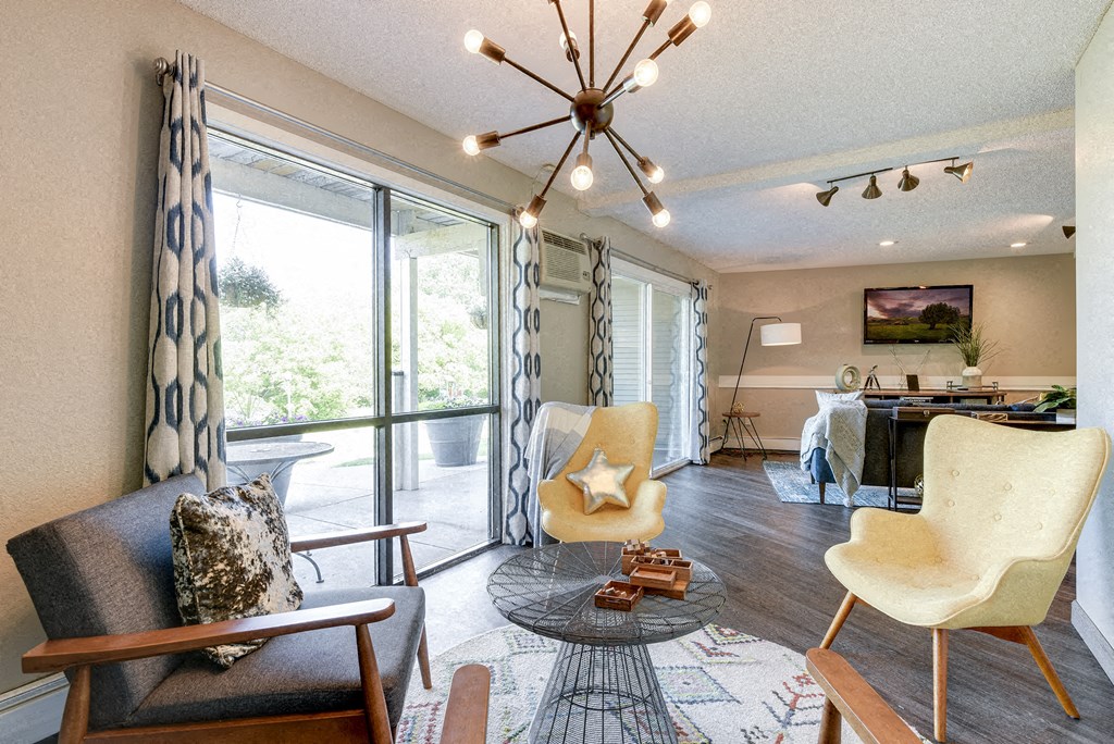 Community Room with a large window and a chandelier
