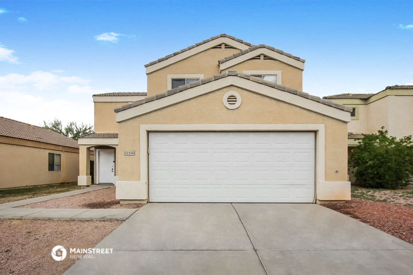 a house with a white garage door in front of it
