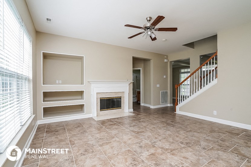 the family room has a fireplace and built in shelves