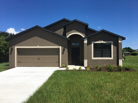 a house with a driveway and a garage door