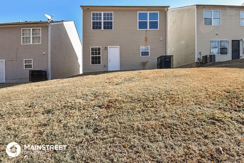 a large yard in front of some houses