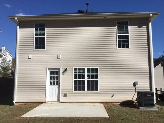 a white house with a white door and windows