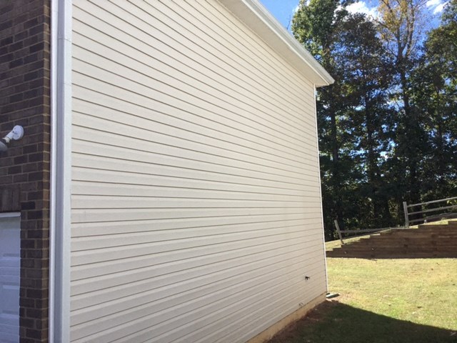 a close up of the side of a building with siding