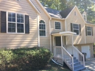 a house with a front porch and a staircase