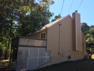 a house with a fence in front of it