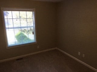 an empty room with a window in it