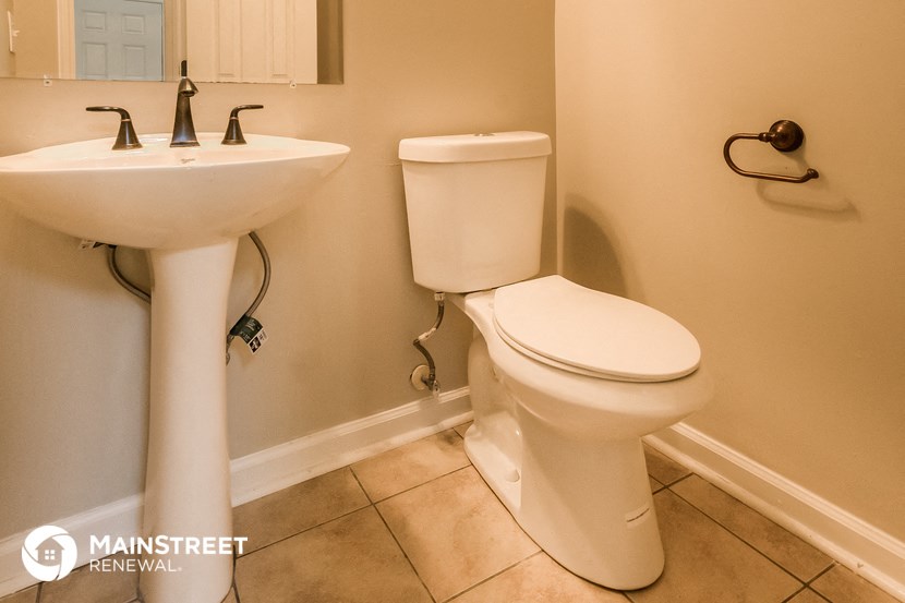 a bathroom with a toilet and a sink