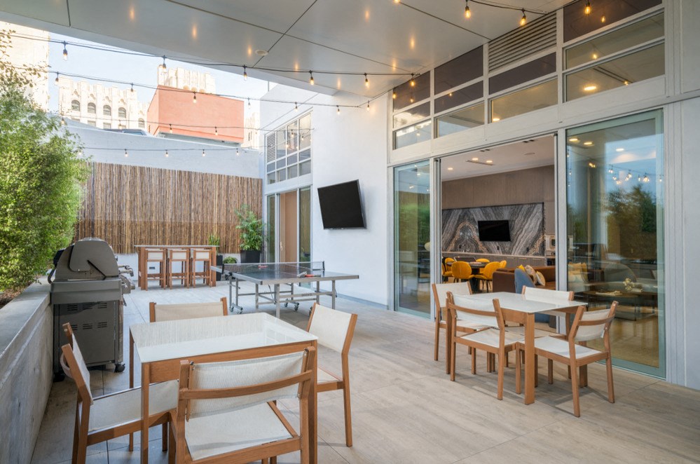 A patio with a table and chairs is shown.