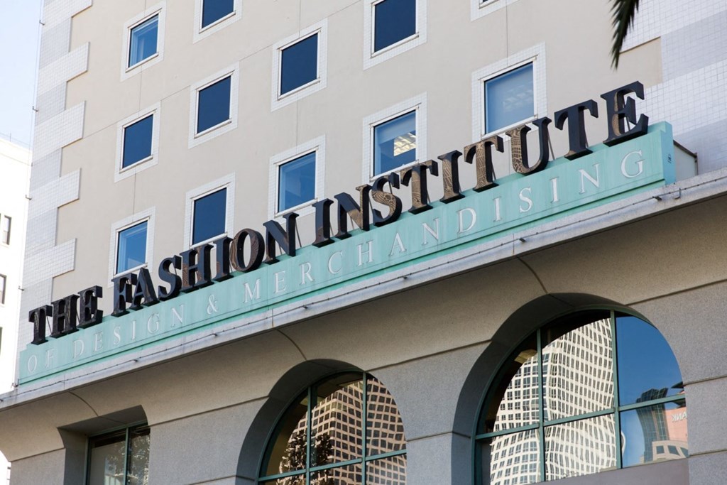 The facade of a building with a sign that reads "The Fashion Institute of Design and Merchandising".