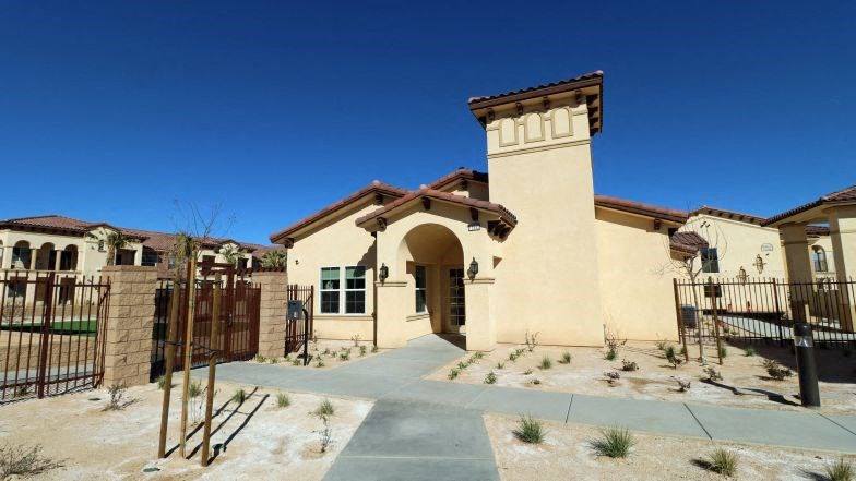 a house with a courtyard and a gate