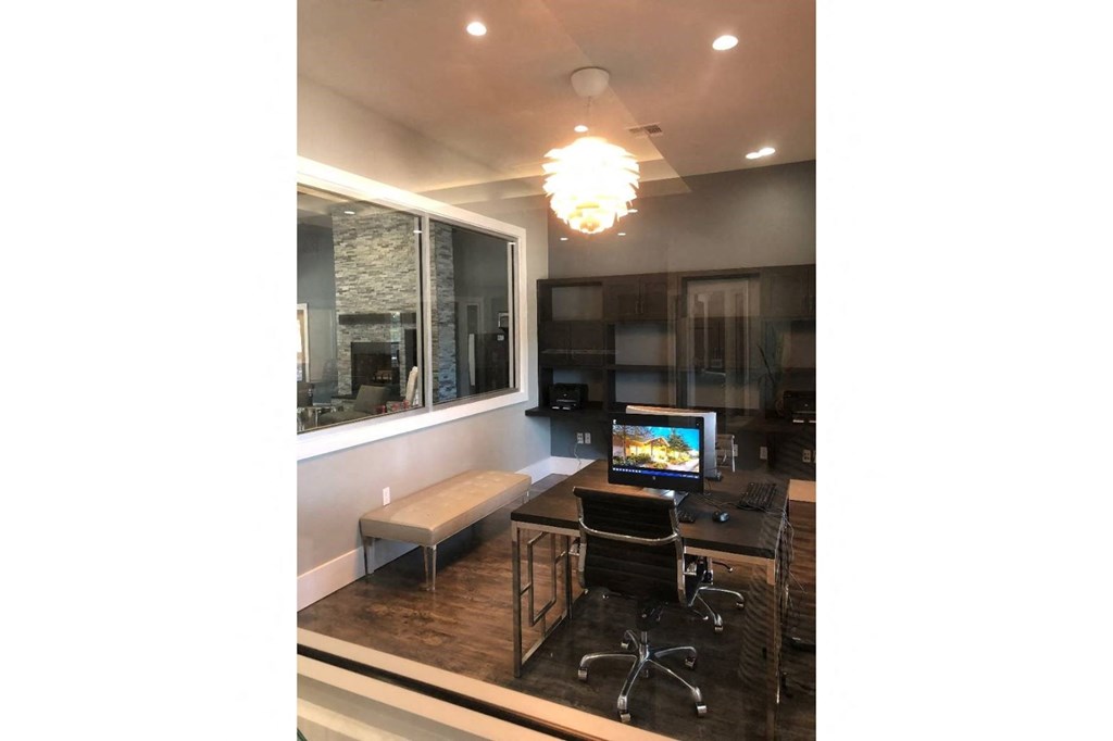 a home office with a desk and a computer