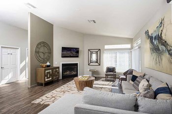 Living room with fireplace l Creekside Village in Pittsburg, CA - Photo Gallery 3