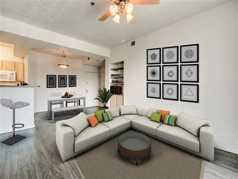 a living room with a white couch and a table