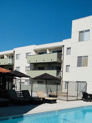 San Pasqual Apartments l Pool Pool with Lounge Chairs Apartments in Pasadena, CA - San Pasquel