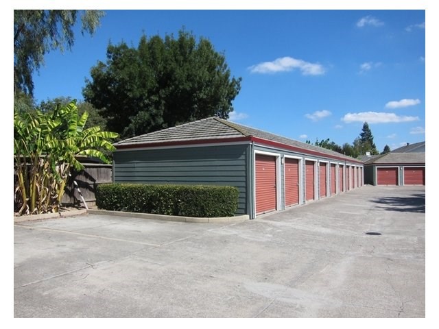 a long row of garages in a parking lot
