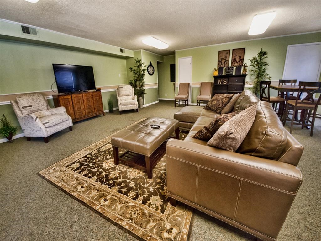 a living room with a couch and a tv
