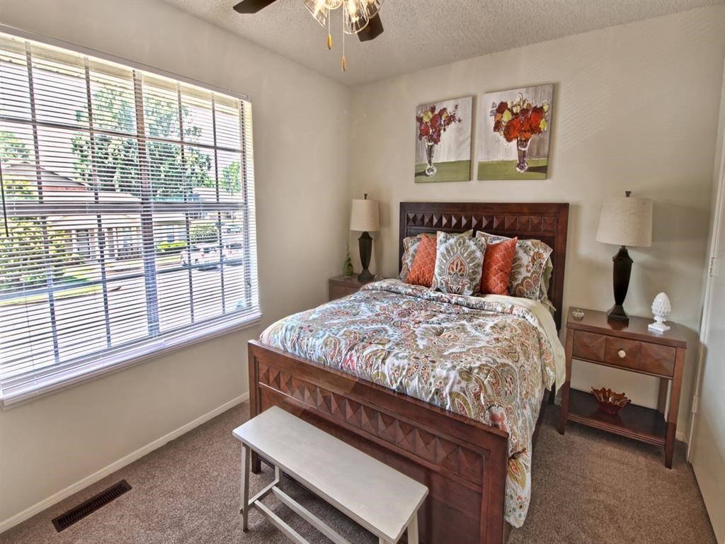 a bedroom with a bed and a window