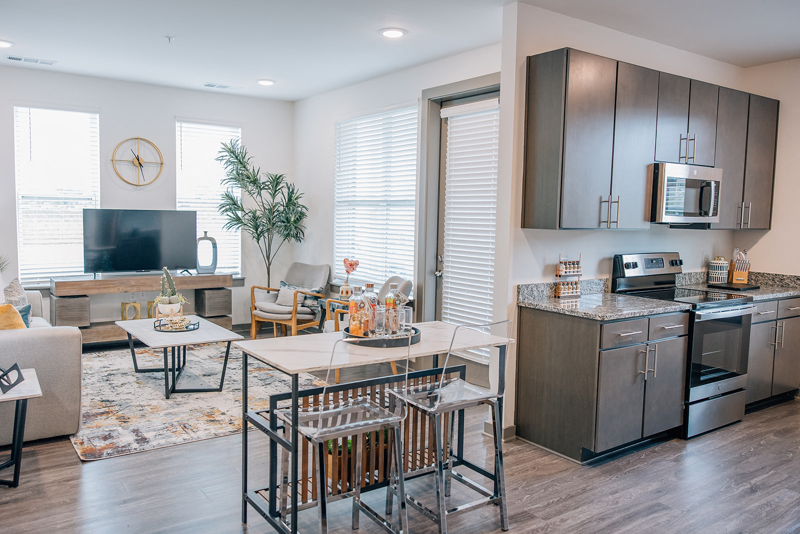 A modern kitchen with a dining table and chairs.