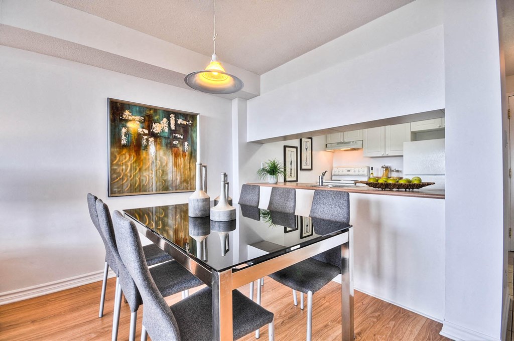 an open kitchen and dining room with a table and chairs