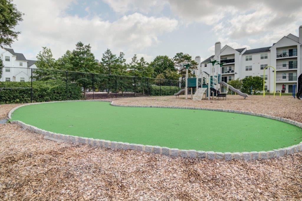 an image of a playground with a green circle in the middle