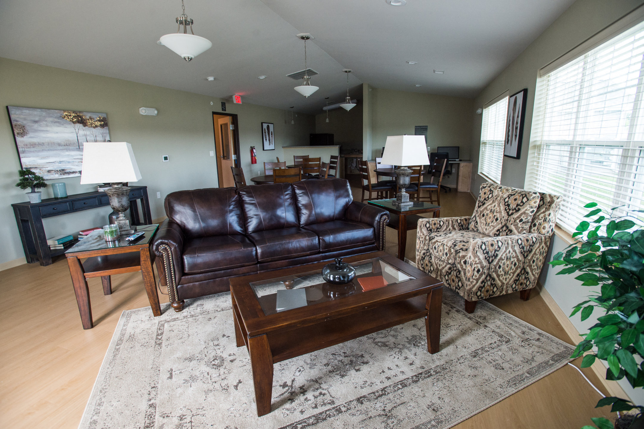 a living room with a leather couch and a coffee table