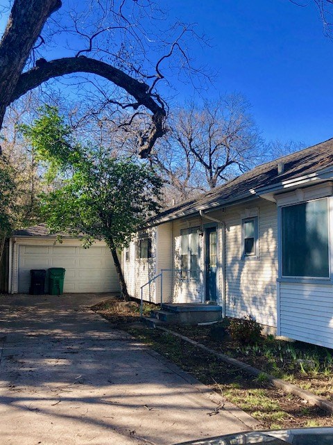 A house with a tree in front of it.
